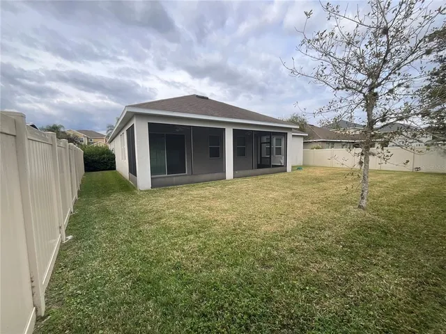 a bathroom with a sink a toilet a mirror and shower