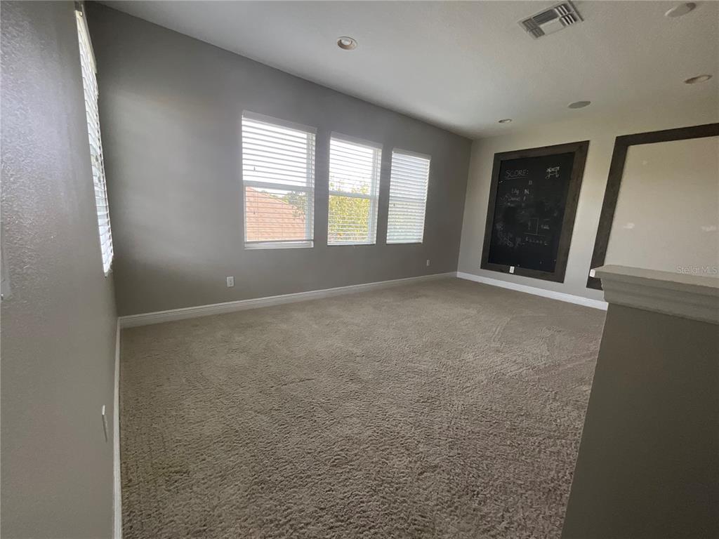 3560 Pixie Lane St. Cloud, FL 34772 - Photo 22 of 74 a view of an empty room with a window