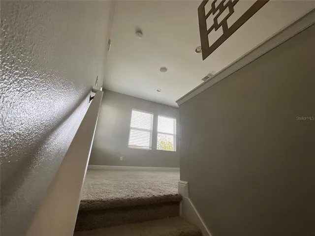 a spacious bathroom with a tub sink shower and mirror