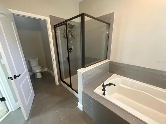 a kitchen with kitchen island granite countertop a sink stainless steel appliances and cabinets