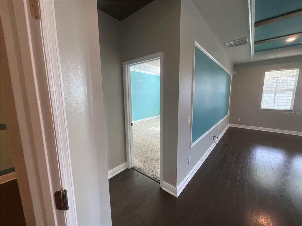 3560 Pixie Lane St. Cloud, FL 34772 - Photo 37 of 74 a view of empty room with wooden floor