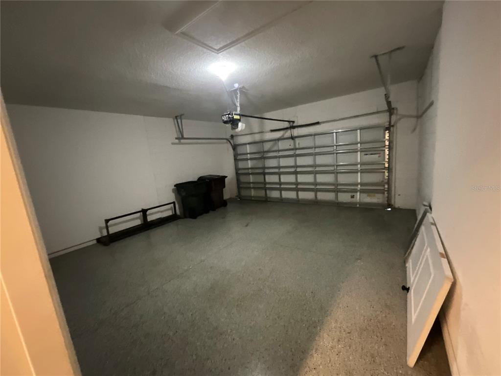 3560 Pixie Lane St. Cloud, FL 34772 - Photo 48 of 74 a view of room that has a car parked in it