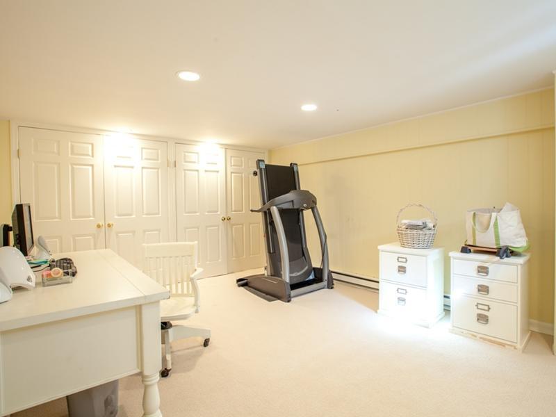 15 Abbey Road Darien, CT 06820 - Photo 15 of 18 a bathroom with a sink a mirror and a shower