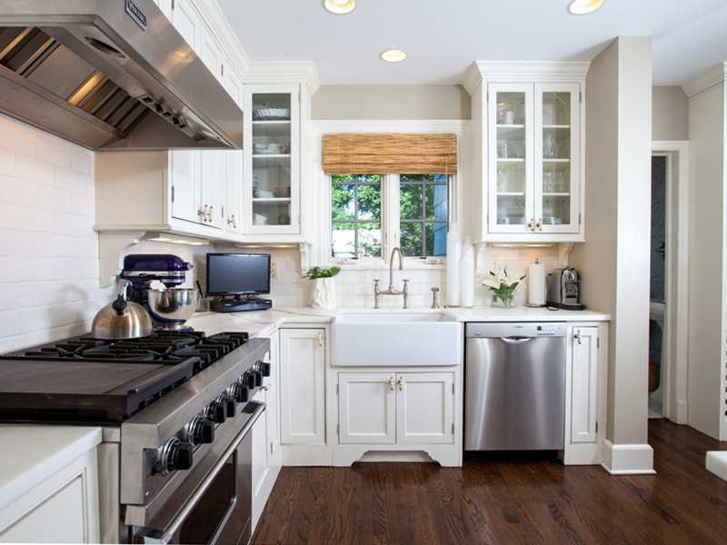15 Abbey Road Darien, CT 06820 - Photo 5 of 18 a kitchen with a stove a sink and a wooden floor