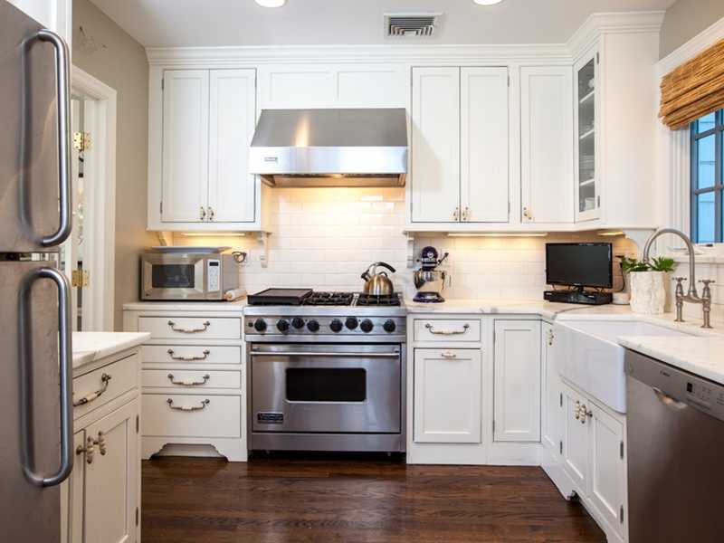 15 Abbey Road Darien, CT 06820 - Photo 6 of 18 a kitchen with cabinets appliances and a window