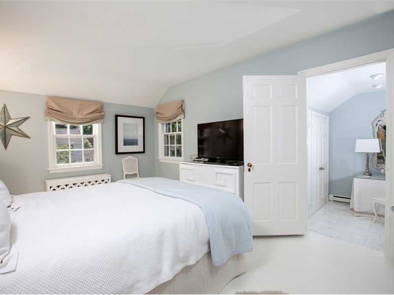 15 Abbey Road Darien, CT 06820 - Photo 9 of 18 a bedroom with a bed and a television