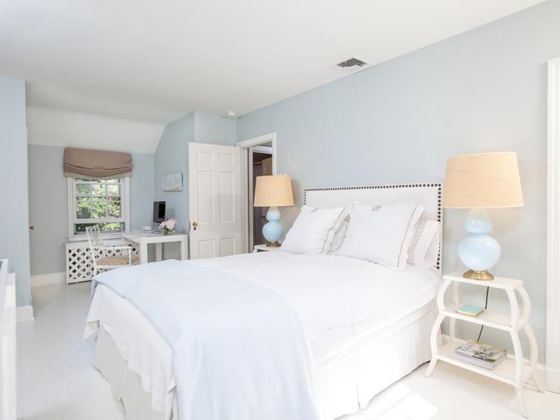 15 Abbey Road Darien, CT 06820 - Photo 10 of 18 a bedroom with a bed and a large mirror