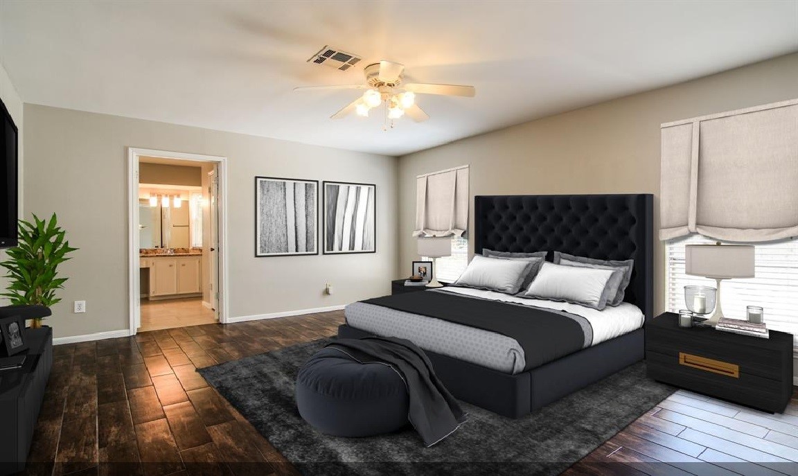 11423 Wickersham Lane Houston, TX 77077 - Photo 14 of 39 a bedroom with a large bed and a chandelier