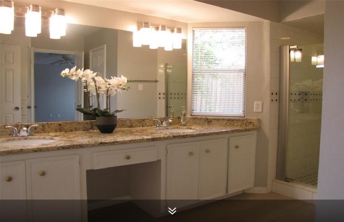 11423 Wickersham Lane Houston, TX 77077 - Photo 22 of 39 a bathroom with a granite countertop sink and a mirror