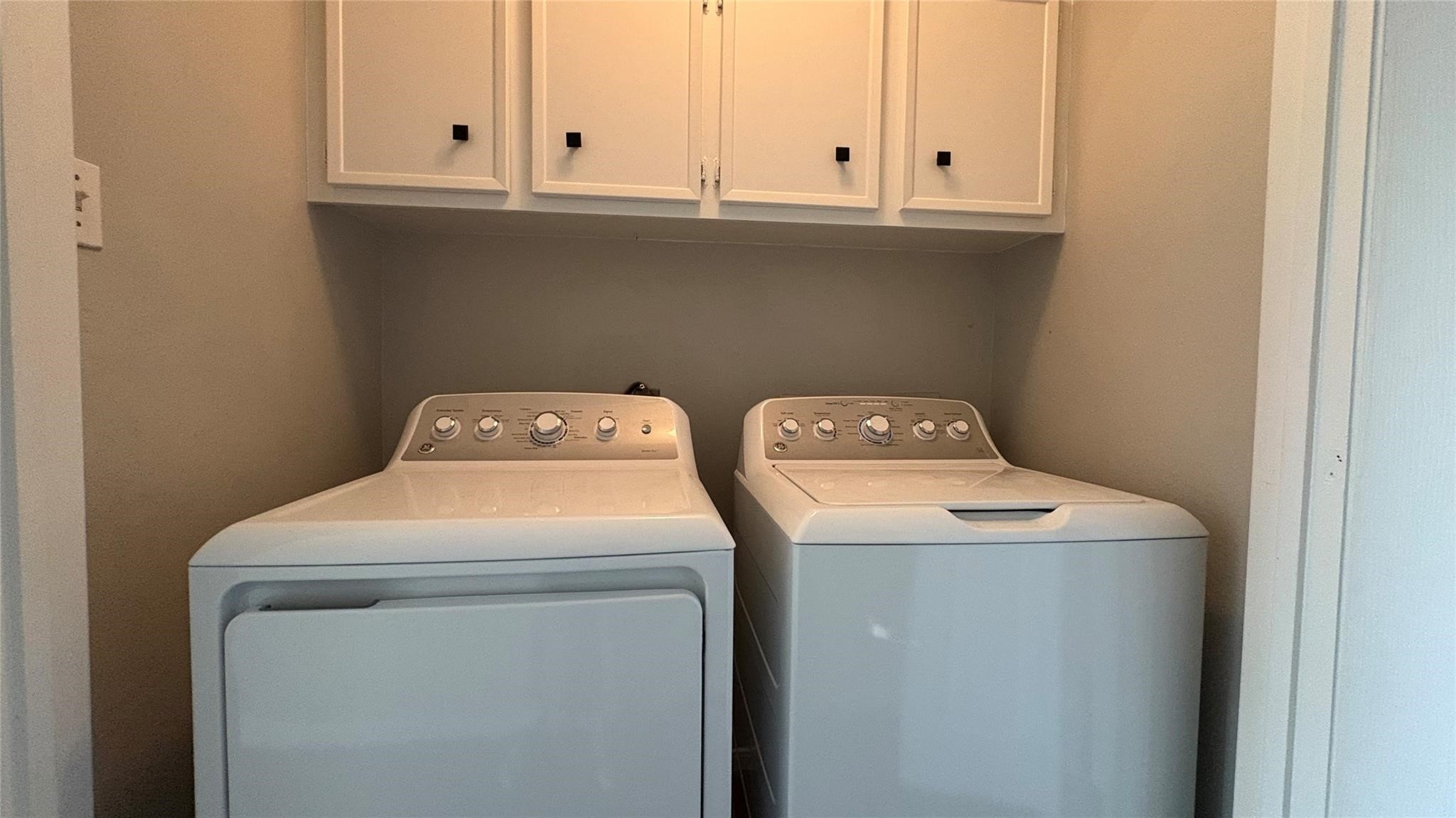 11423 Wickersham Lane Houston, TX 77077 - Photo 23 of 39 a utility room with dryer and washer