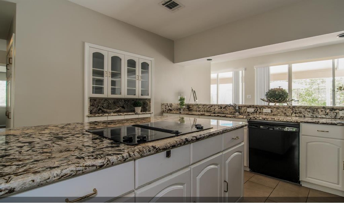 11423 Wickersham Lane Houston, TX 77077 - Photo 6 of 39 a kitchen with a sink and cabinets