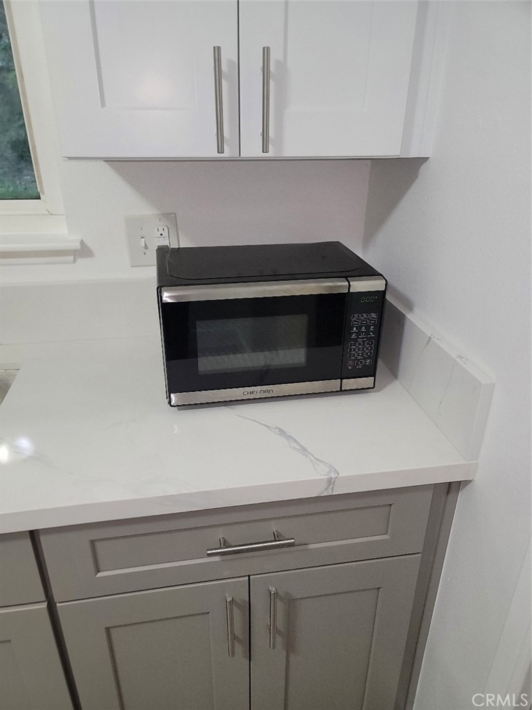 6984 Center Street Highland, CA 92346 - Photo 15 of 24 a close view of a stove in the kitchen