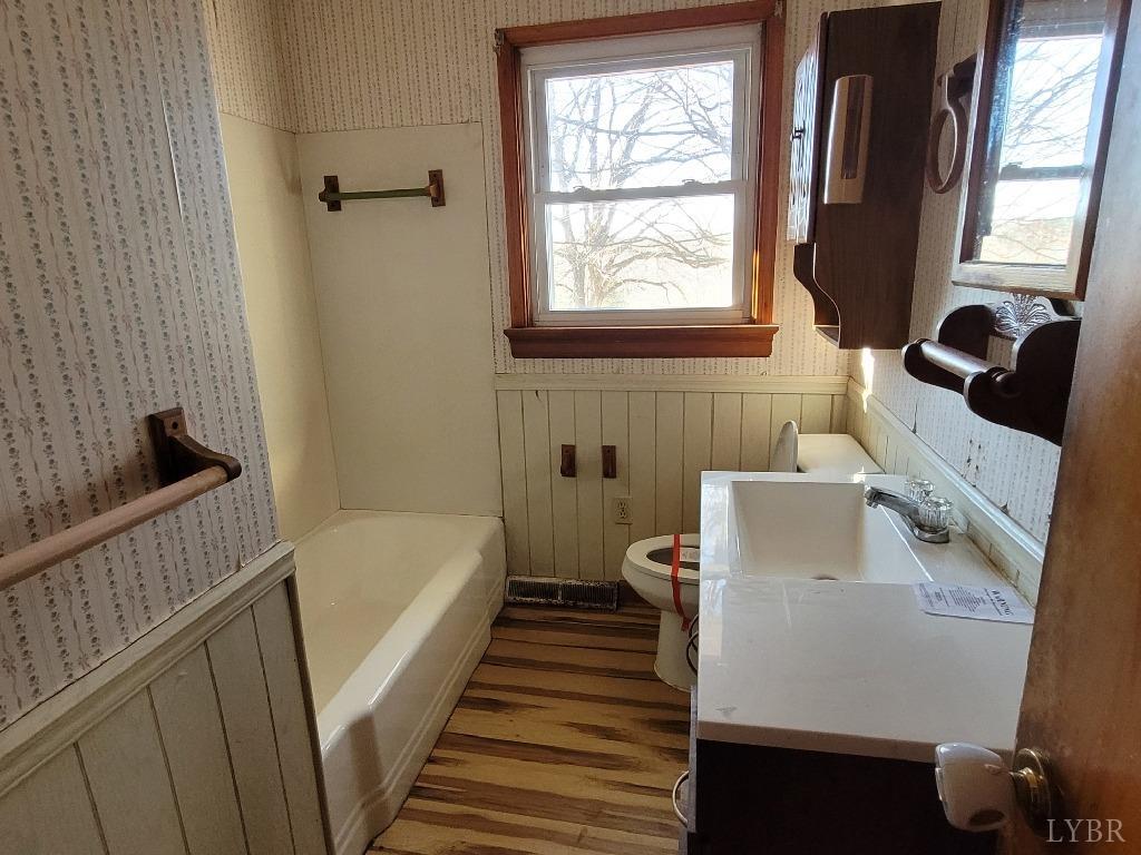 1025 Country Club Road Hurt, VA 24563 - Photo 11 of 15 a bathroom with a sink and a bathtub