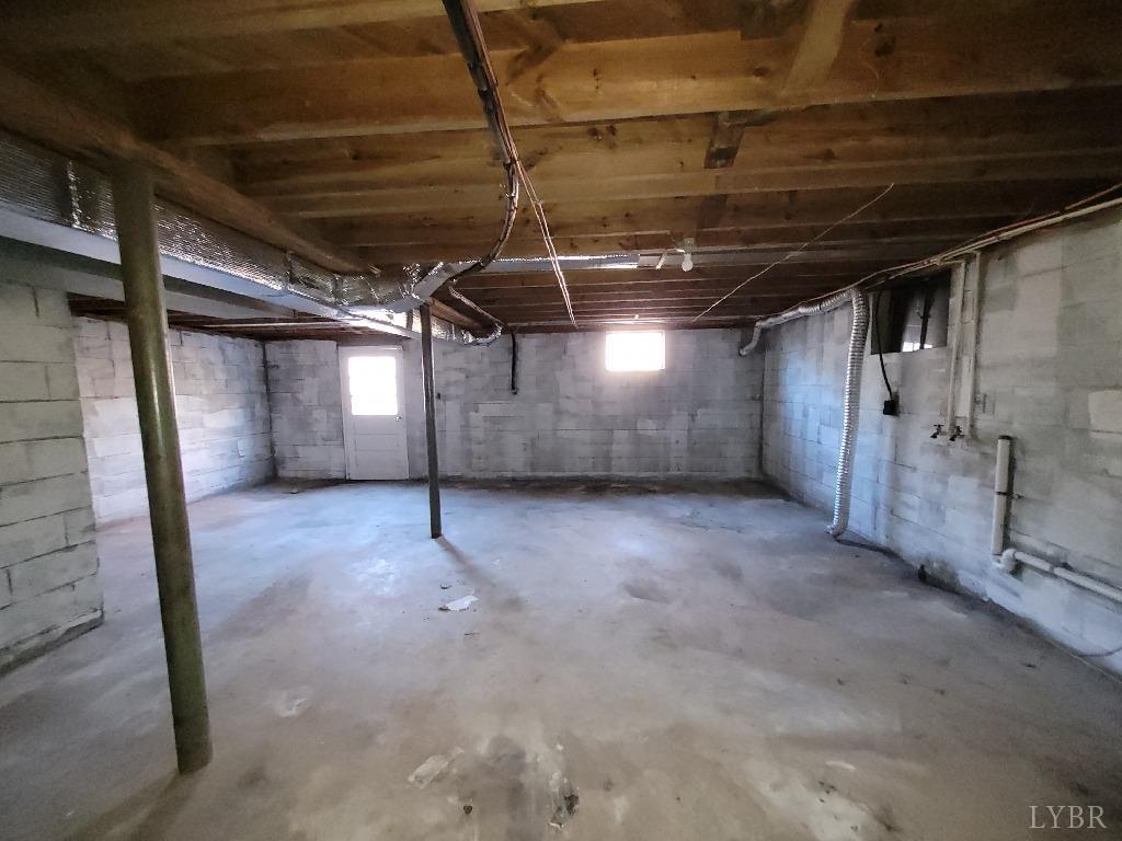 1025 Country Club Road Hurt, VA 24563 - Photo 14 of 15 a view of empty room with wooden walls