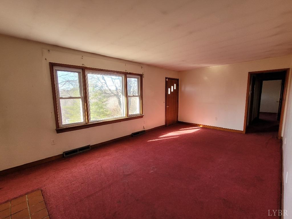 1025 Country Club Road Hurt, VA 24563 - Photo 6 of 15 an empty room with windows