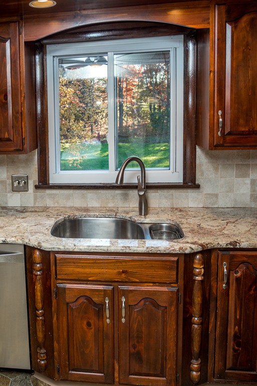 50 Mueller Road Holyoke, MA 01040 - Photo 11 of 30 a kitchen with granite countertop a sink and a window
