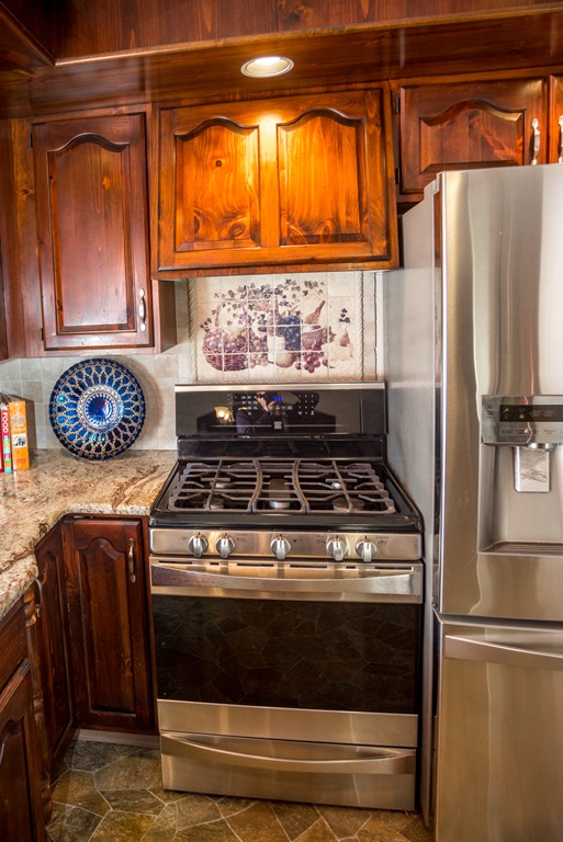 50 Mueller Road Holyoke, MA 01040 - Photo 13 of 30 a stove top oven sitting inside of a kitchen