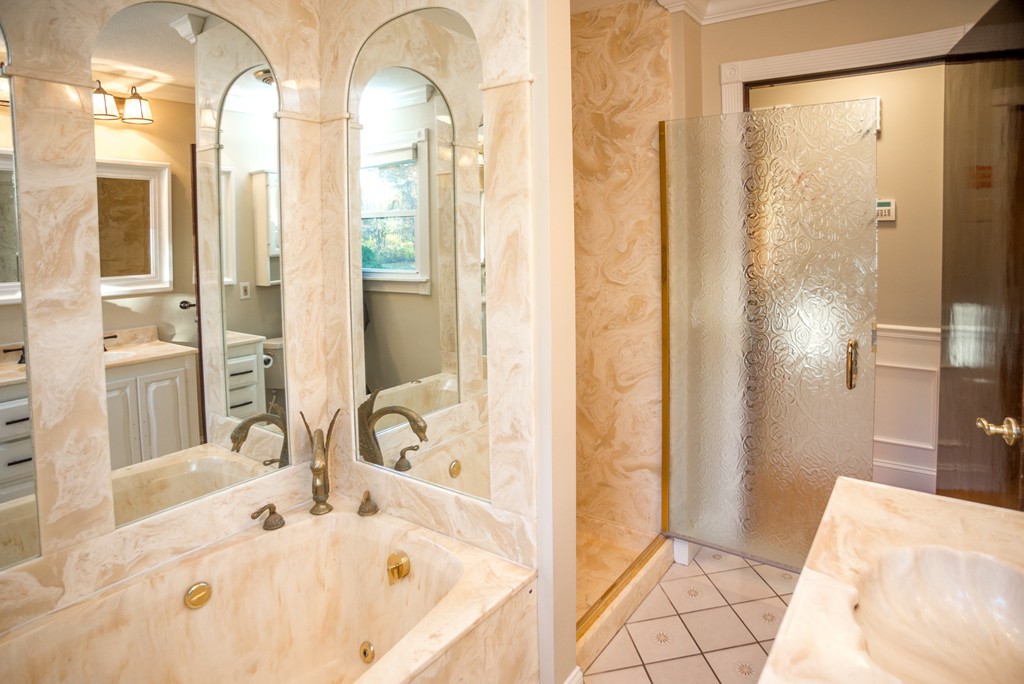 50 Mueller Road Holyoke, MA 01040 - Photo 17 of 30 a bathroom with a tub sink and shower