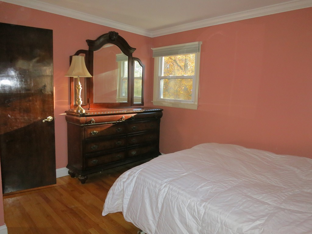 50 Mueller Road Holyoke, MA 01040 - Photo 21 of 30 a bedroom with a bed and a window