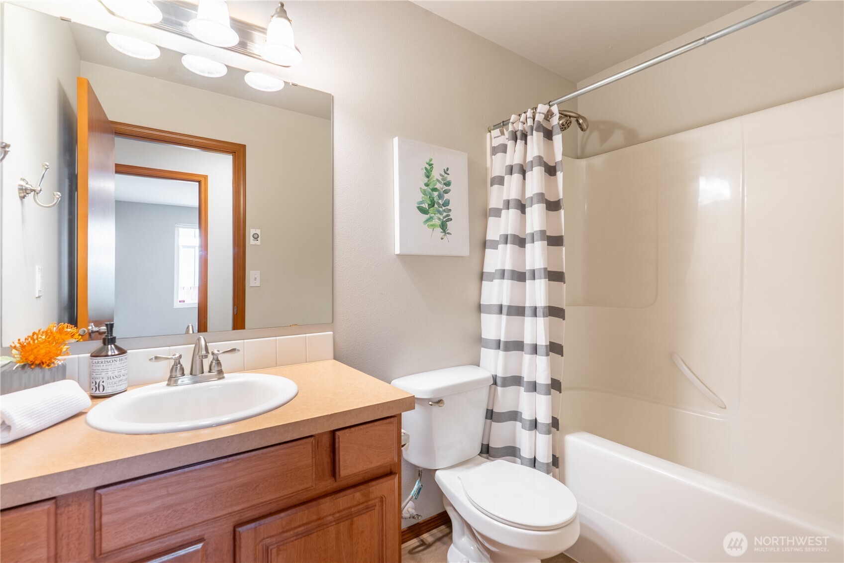 242 Riggs Drive East Enumclaw, WA 98022 - Photo 21 of 40 a bathroom with a sink a toilet and shower