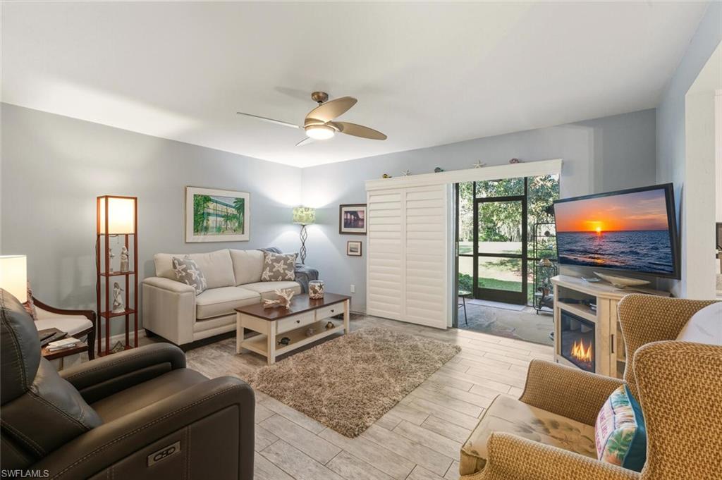 7380 St Ives Way, Unit 1108 Naples, FL 34104 - Photo 3 of 46 LIVING ROOM WITH PLANTATION SHUTTERS