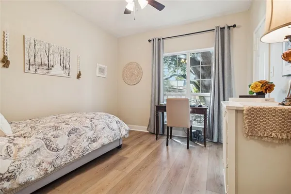 a bedroom with a bed and a table in it