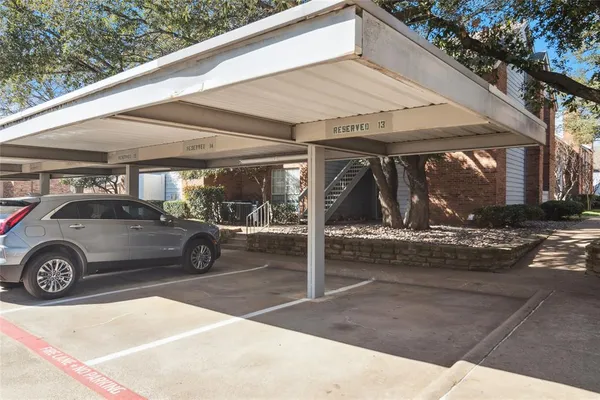 a view of parking garage with cars