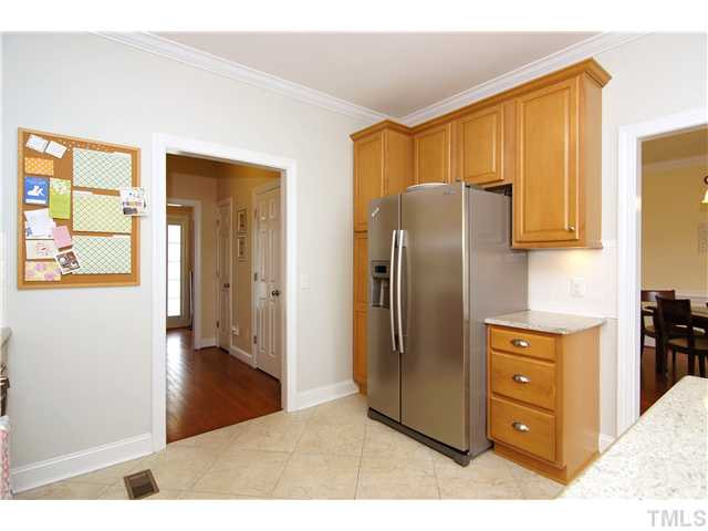 6 Kilary Drive Durham, NC 27713 - Photo 11 of 25 a kitchen with stainless steel appliances granite countertop a refrigerator and a stove top oven