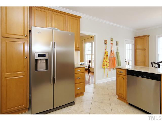 6 Kilary Drive Durham, NC 27713 - Photo 12 of 25 a kitchen with stainless steel appliances a refrigerator and a stove
