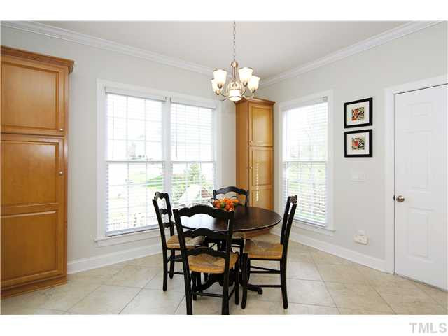 6 Kilary Drive Durham, NC 27713 - Photo 14 of 25 a view of a dining room with furniture a chandelier and wooden floor