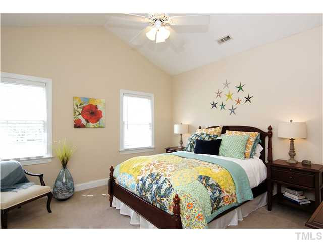 6 Kilary Drive Durham, NC 27713 - Photo 15 of 25 a bedroom with a bed and a chandelier