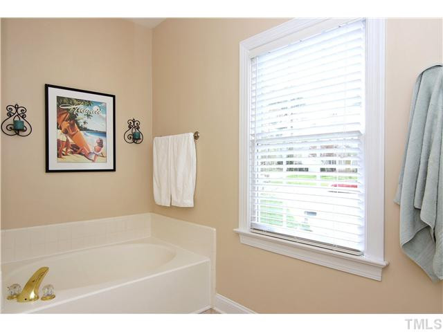 6 Kilary Drive Durham, NC 27713 - Photo 18 of 25 a white bath tub sitting next to a window