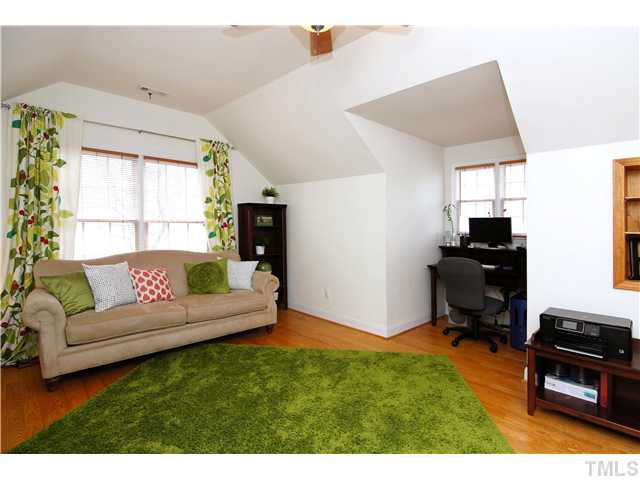 6 Kilary Drive Durham, NC 27713 - Photo 21 of 25 a living room with furniture and a flat screen tv