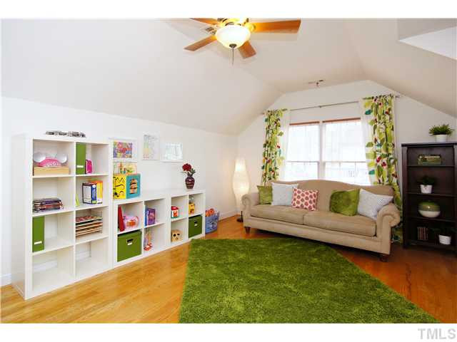 6 Kilary Drive Durham, NC 27713 - Photo 22 of 25 a living room with furniture and a book shelf