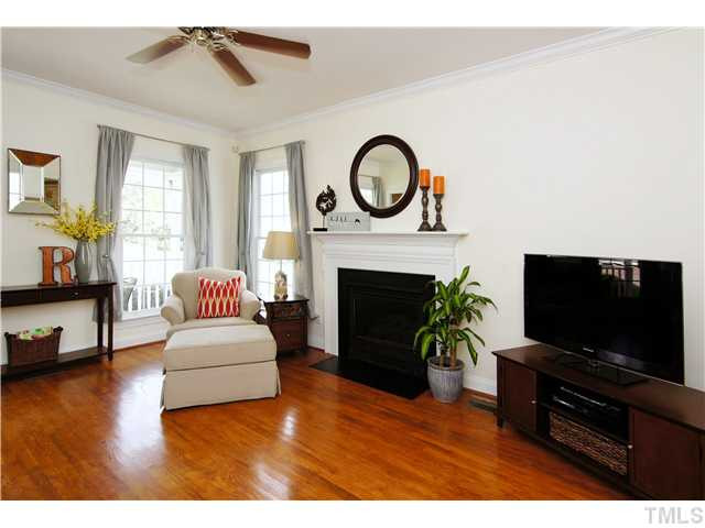 6 Kilary Drive Durham, NC 27713 - Photo 5 of 25 a living room with furniture a fireplace and a flat screen tv