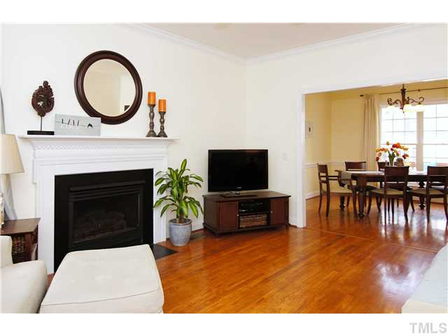 6 Kilary Drive Durham, NC 27713 - Photo 6 of 25 a living room with furniture a fireplace and a flat screen tv