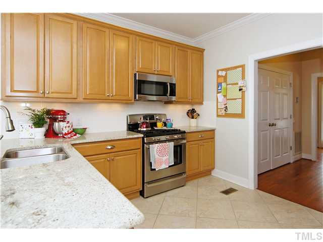 6 Kilary Drive Durham, NC 27713 - Photo 10 of 25 a kitchen with stainless steel appliances granite countertop a stove a sink and a microwave