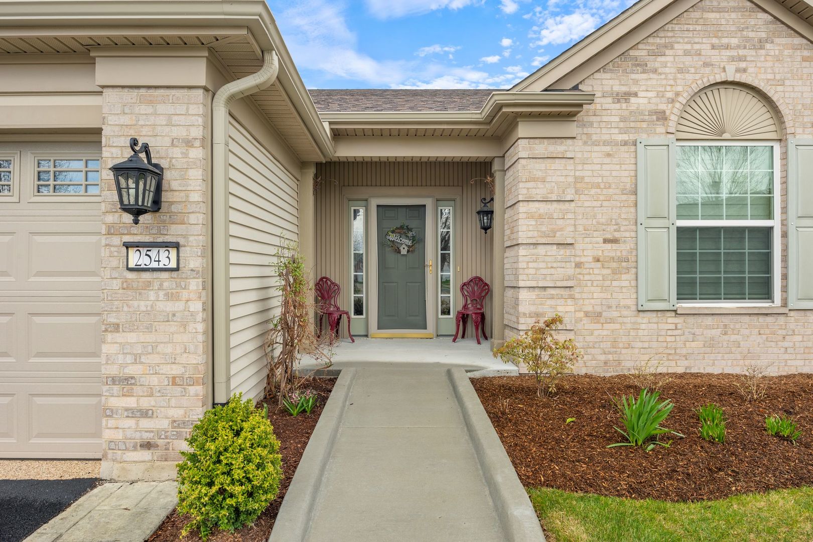 2543 Edgewater Drive Elgin, IL 60124 - Photo 4 of 9 a view of a brick house with a large windows