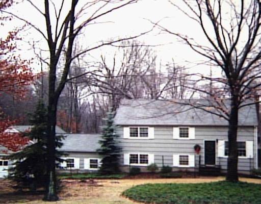 129 Linden Tree Road Wilton, CT 06897 - Photo 1 of 1 front view of a house with a yard