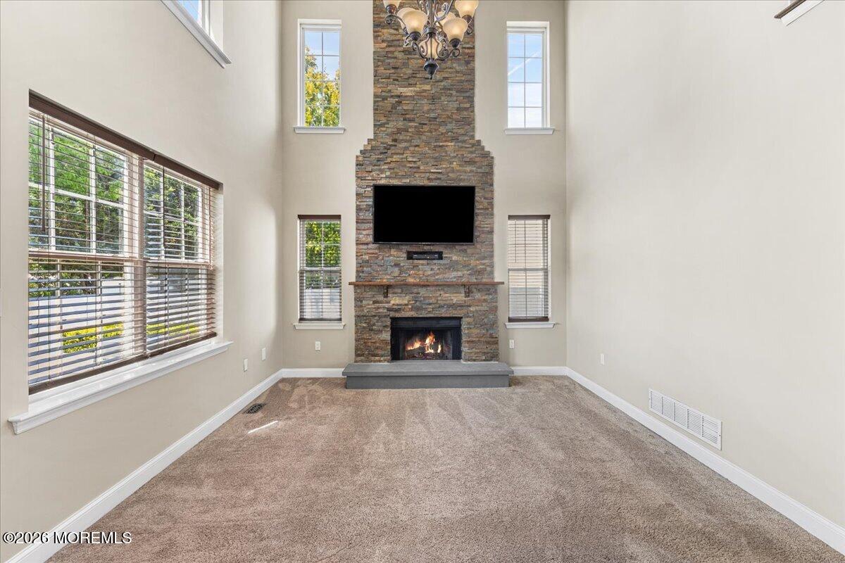49 Diamond Lane Howell, NJ 07731 - Photo 12 of 46 a view of a livingroom with a fireplace and window