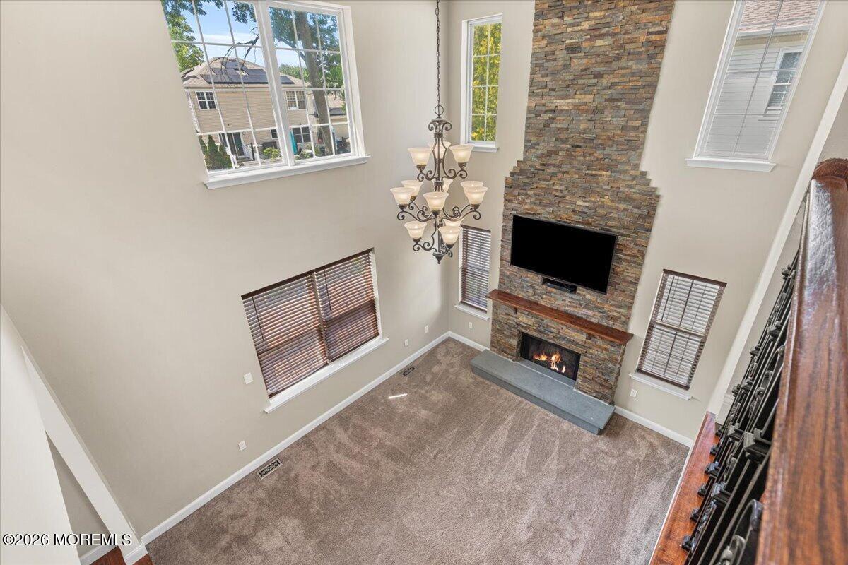 49 Diamond Lane Howell, NJ 07731 - Photo 14 of 46 a living room with furniture and a flat screen tv