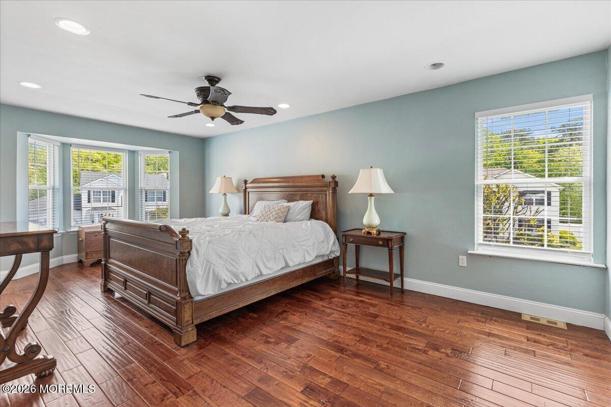 49 Diamond Lane Howell, NJ 07731 - Photo 20 of 46 a bedroom with a bed chandelier and next to a window