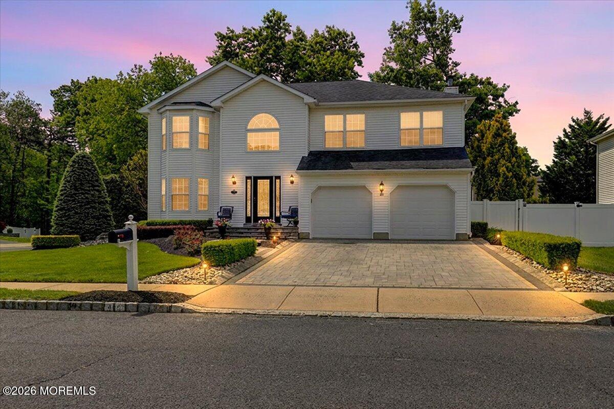 49 Diamond Lane Howell, NJ 07731 - Photo 2 of 46 a front view of a house with a yard and garage