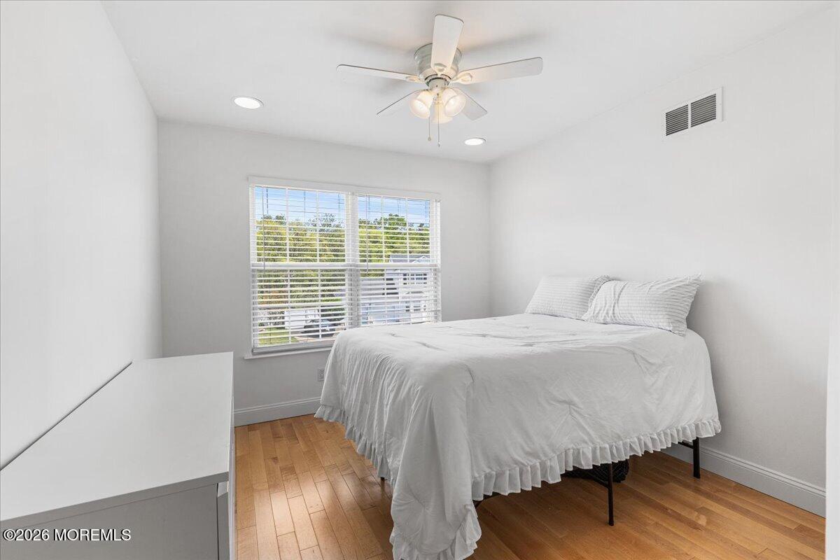 49 Diamond Lane Howell, NJ 07731 - Photo 24 of 46 a large bed sitting in a bedroom next to a window