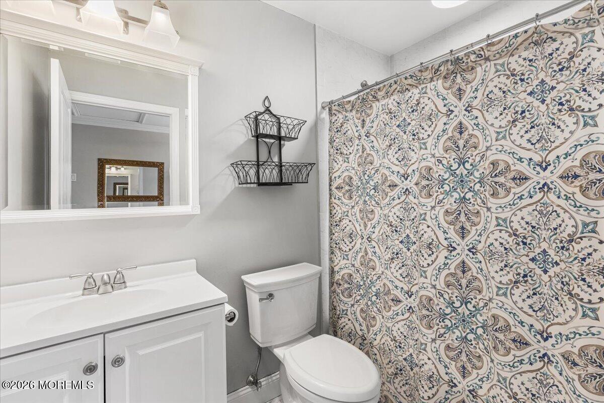 49 Diamond Lane Howell, NJ 07731 - Photo 25 of 46 a white toilet sitting next to a bathroom sink