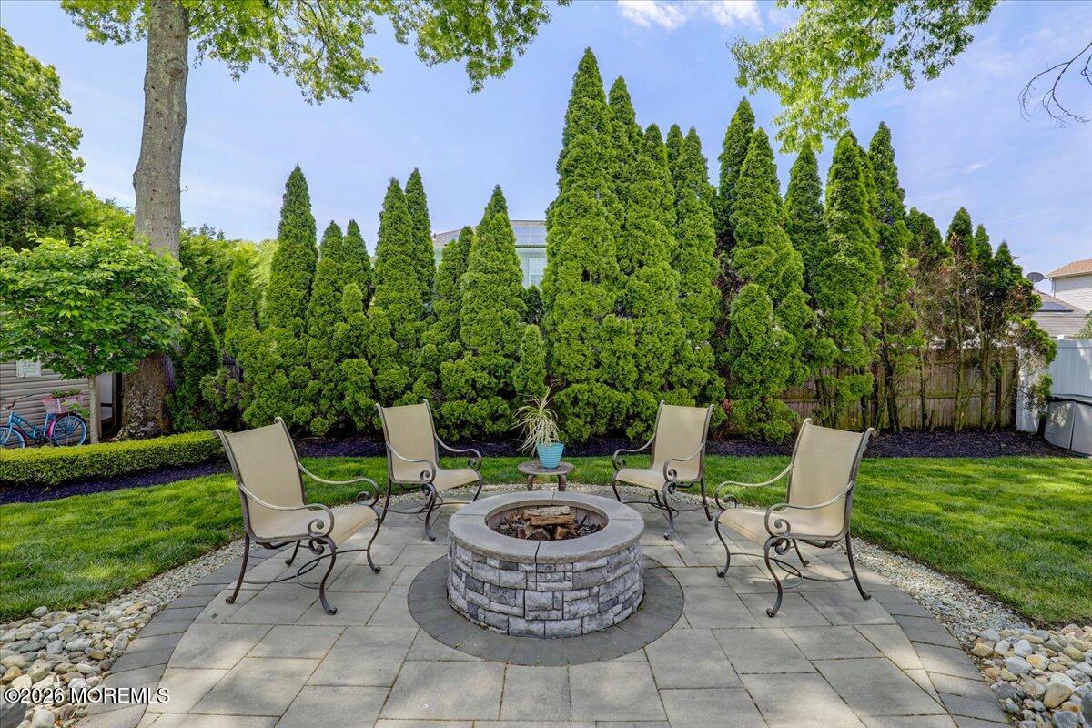 49 Diamond Lane Howell, NJ 07731 - Photo 30 of 46 a view of a chair and table in backyard of the house