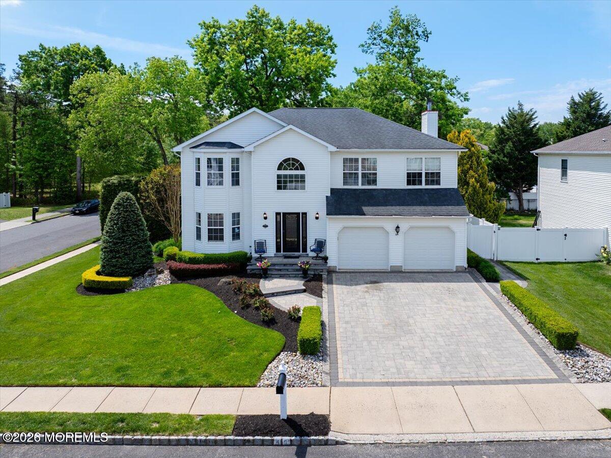 49 Diamond Lane Howell, NJ 07731 - Photo 3 of 46 a view of a white house with a yard patio and a small yard