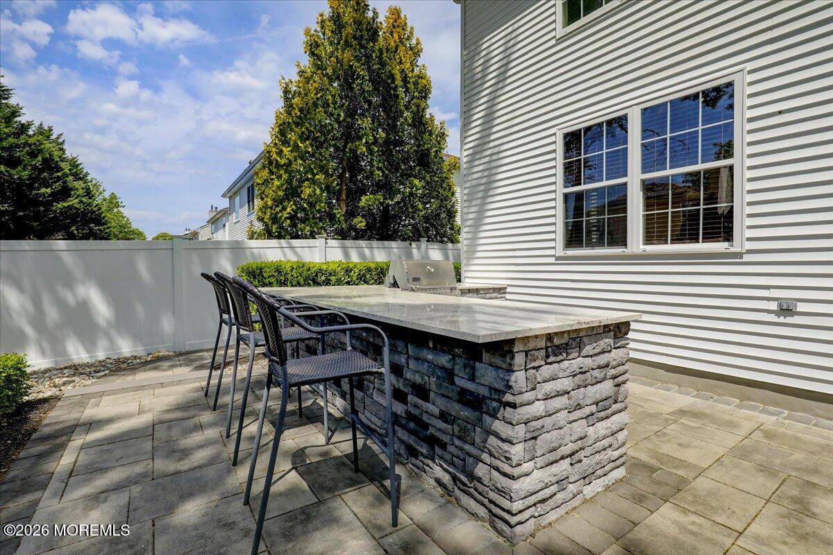 49 Diamond Lane Howell, NJ 07731 - Photo 34 of 46 a backyard of a house with table and chairs