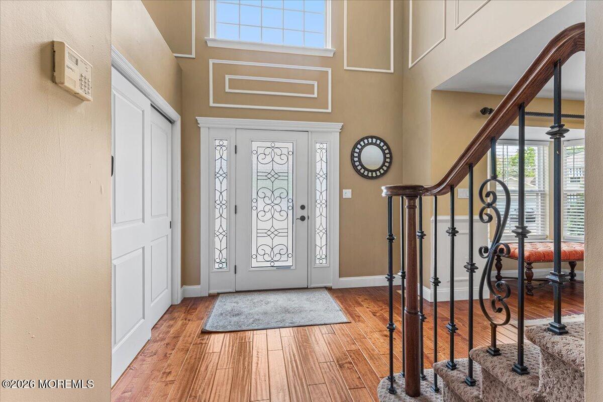 49 Diamond Lane Howell, NJ 07731 - Photo 6 of 46 a view of a hallway with wooden floor and door