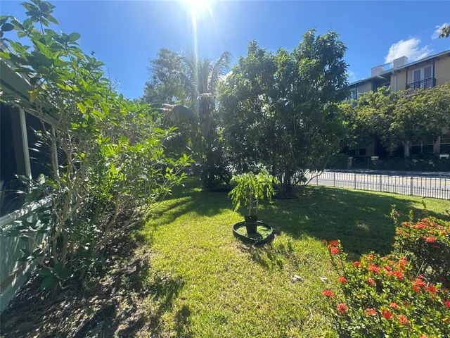 a view of a garden with a fountain